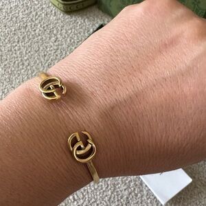 Gucci Gold-Tone Open Cuff Bracelet with Interlocking G Ends
